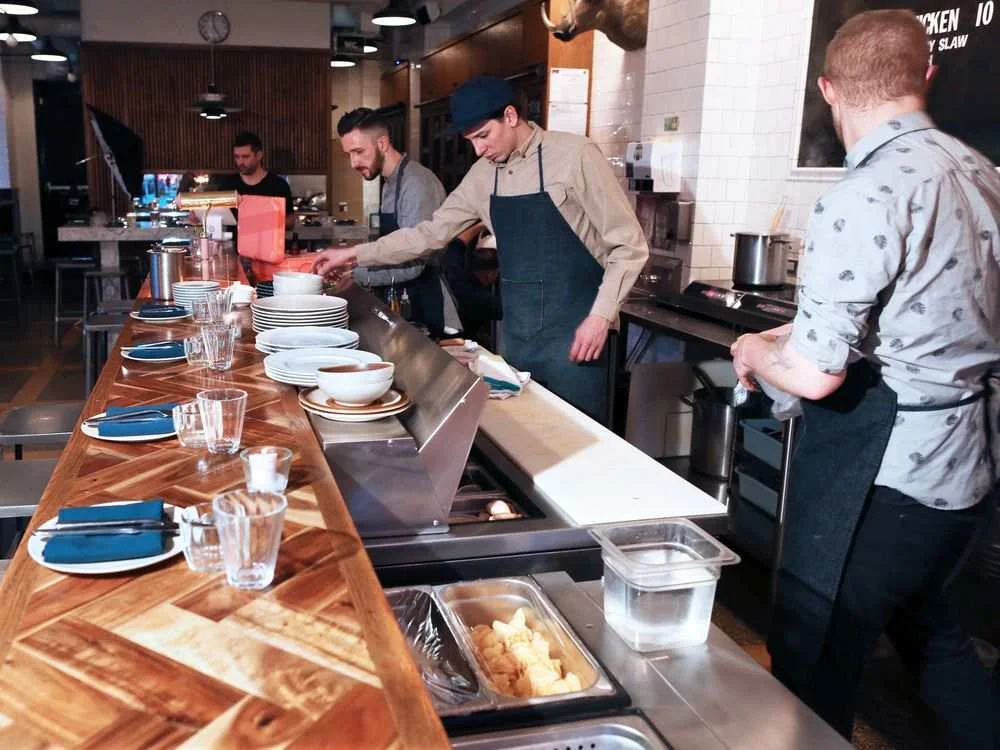Chefs from left: Bern Glatz, Nick Berenyi and Zander Hamm with the Nights and Weekends pop-up restaurant get food ready before opening in the Meat and Bread sandwich shop. Gavin Young/Postmedia GAVIN YOUNG / CALWP