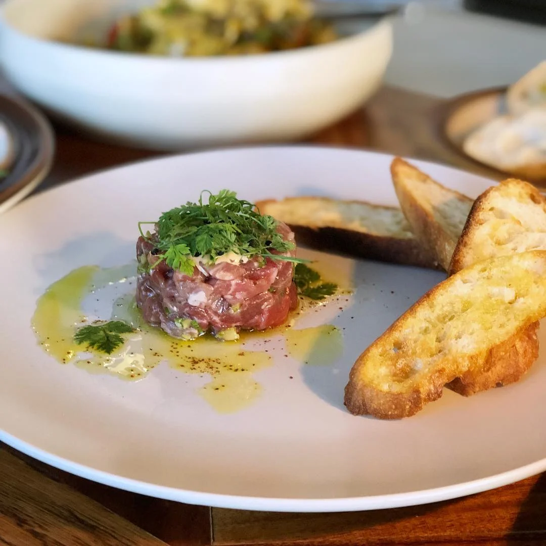 Lamb Tartare - Ewe-Nique Farms lamb, Porter Beer Sauce, Sumac, Olive Oil, Chervil, Sidewalk Citizen Baguette
