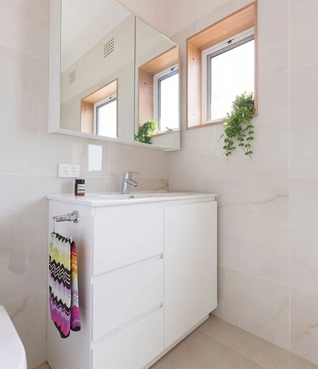 Plenty of storage is so important for a family bathroom! 
This main bathroom from our Griffith renovation features @grohe_global taps from our partners @reecebathrooms. 
Also, check out the custom windows by @hardwoodprojects which have become a bit 