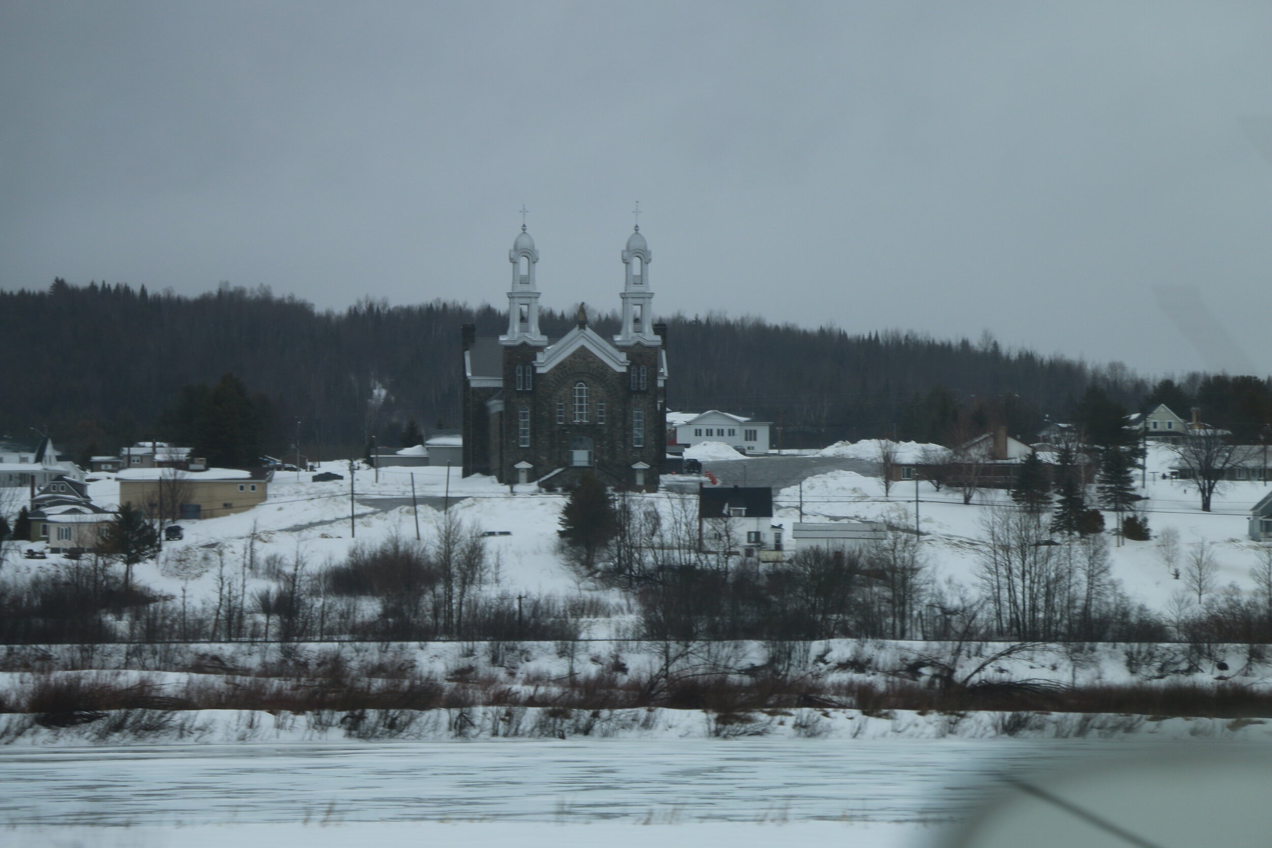   A view of a church in Canada from across the St. Johns.  