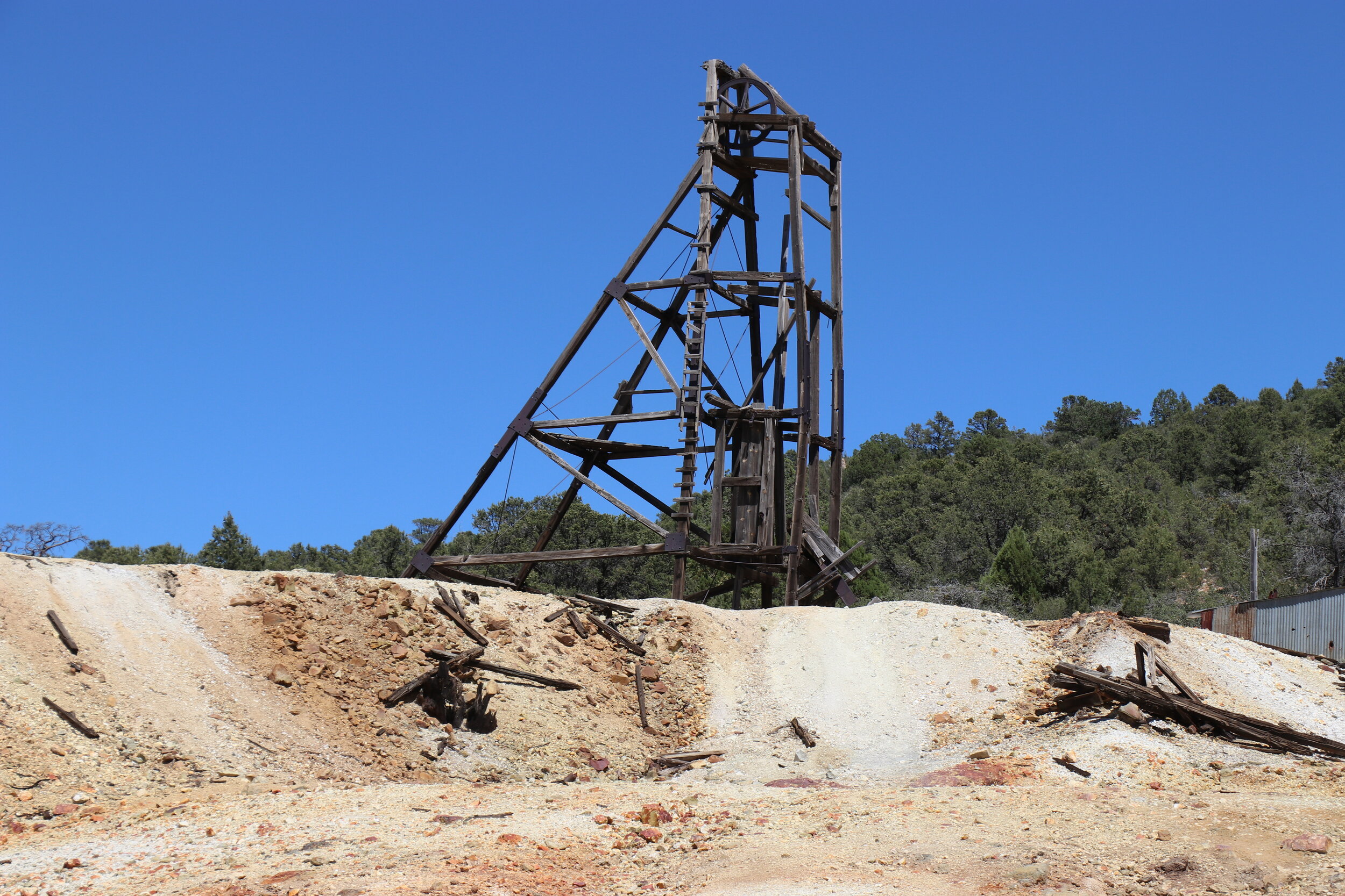 The headframe sits atop the tailings pile.