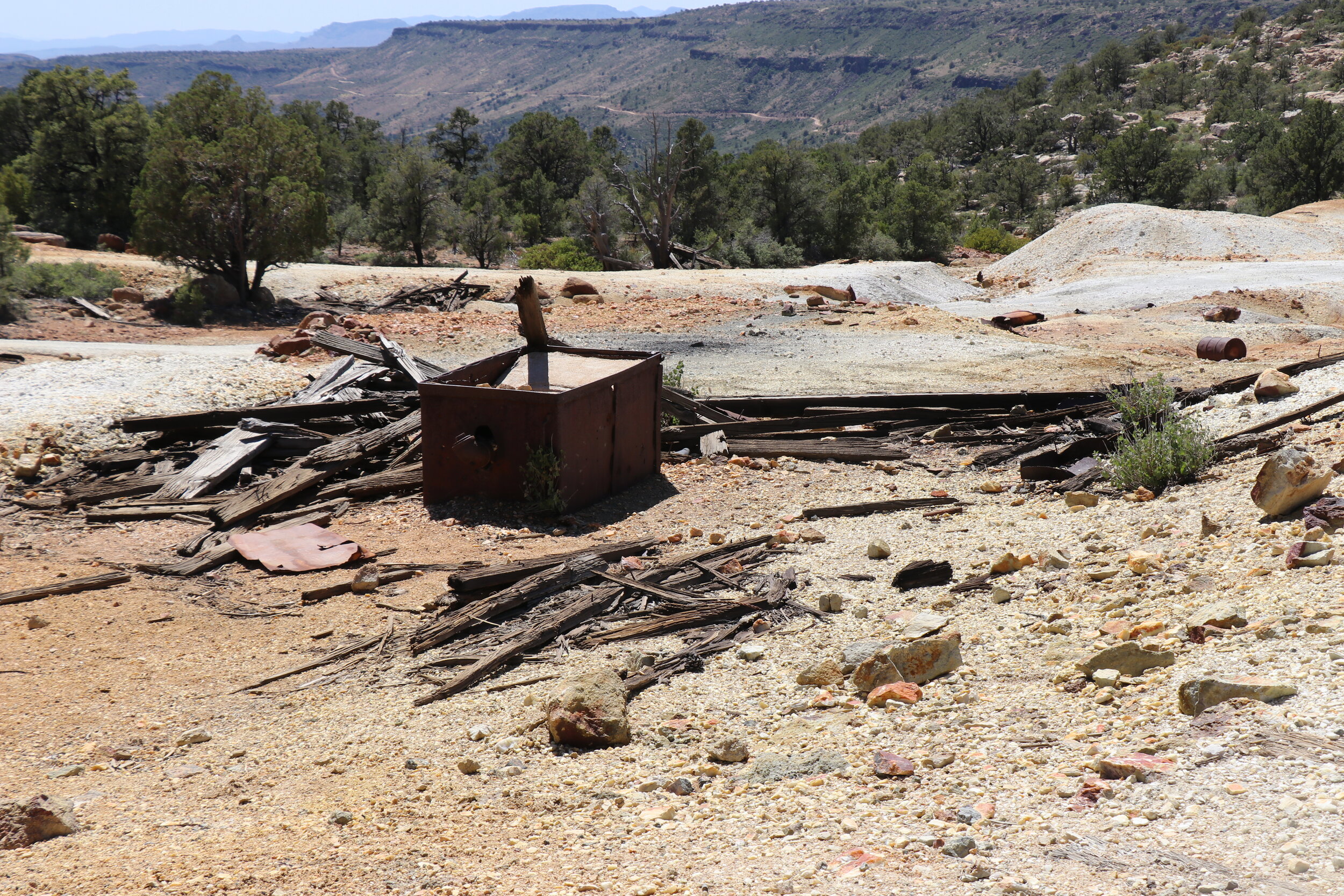 Numerous pieces remain scattered around the tailings pile.