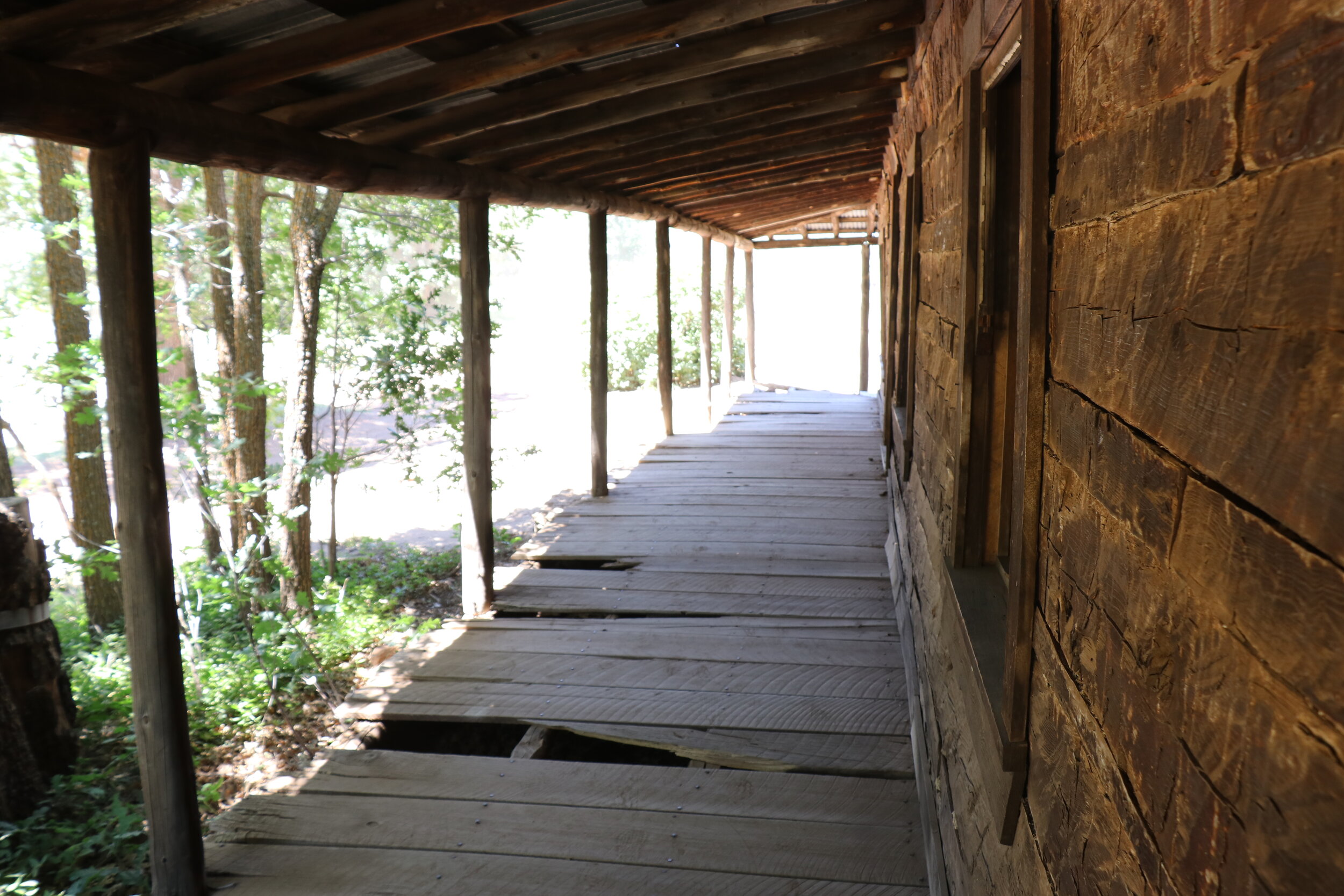 A large porch wraps around much of the structure.