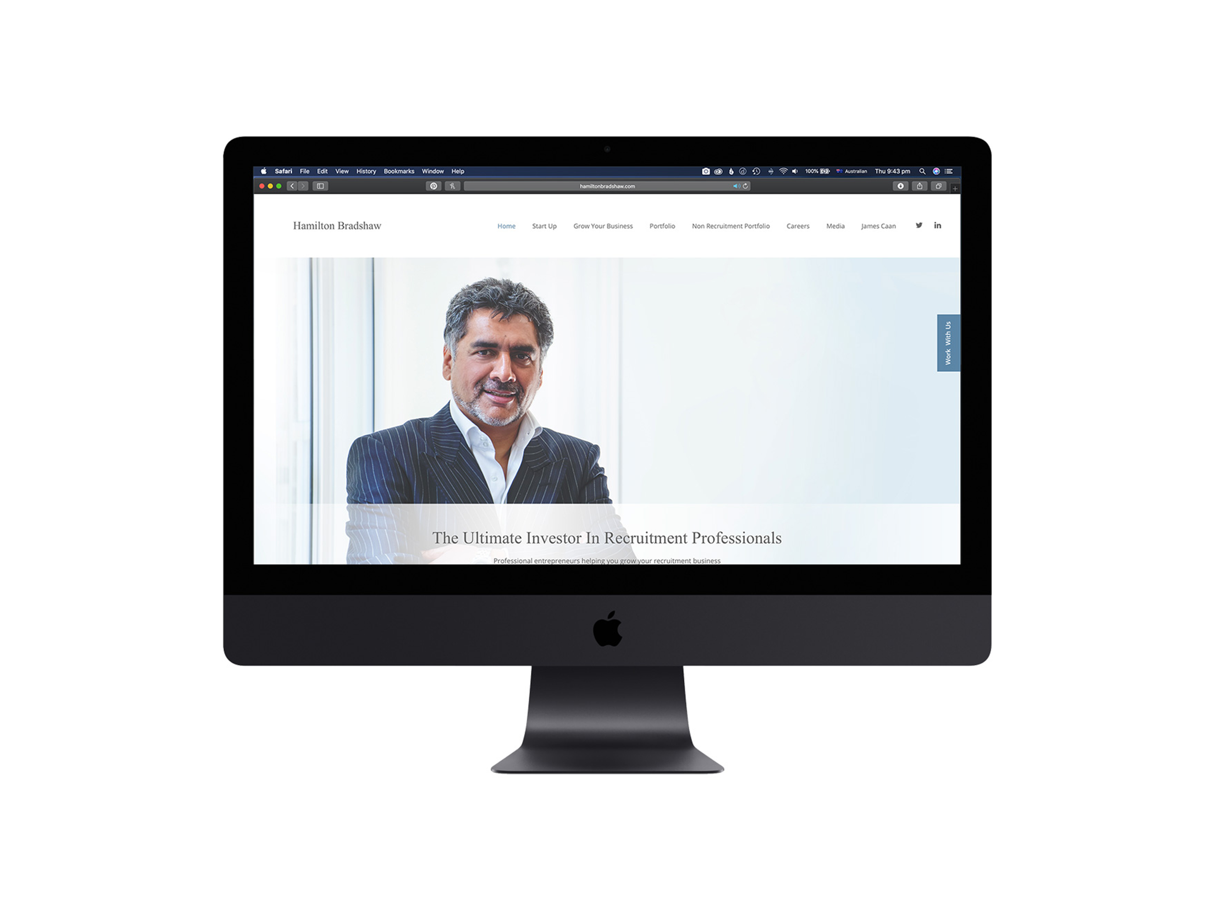 Computer monitor displaying a professional website with a man in a suit and text indicating recruitment and business growth.
