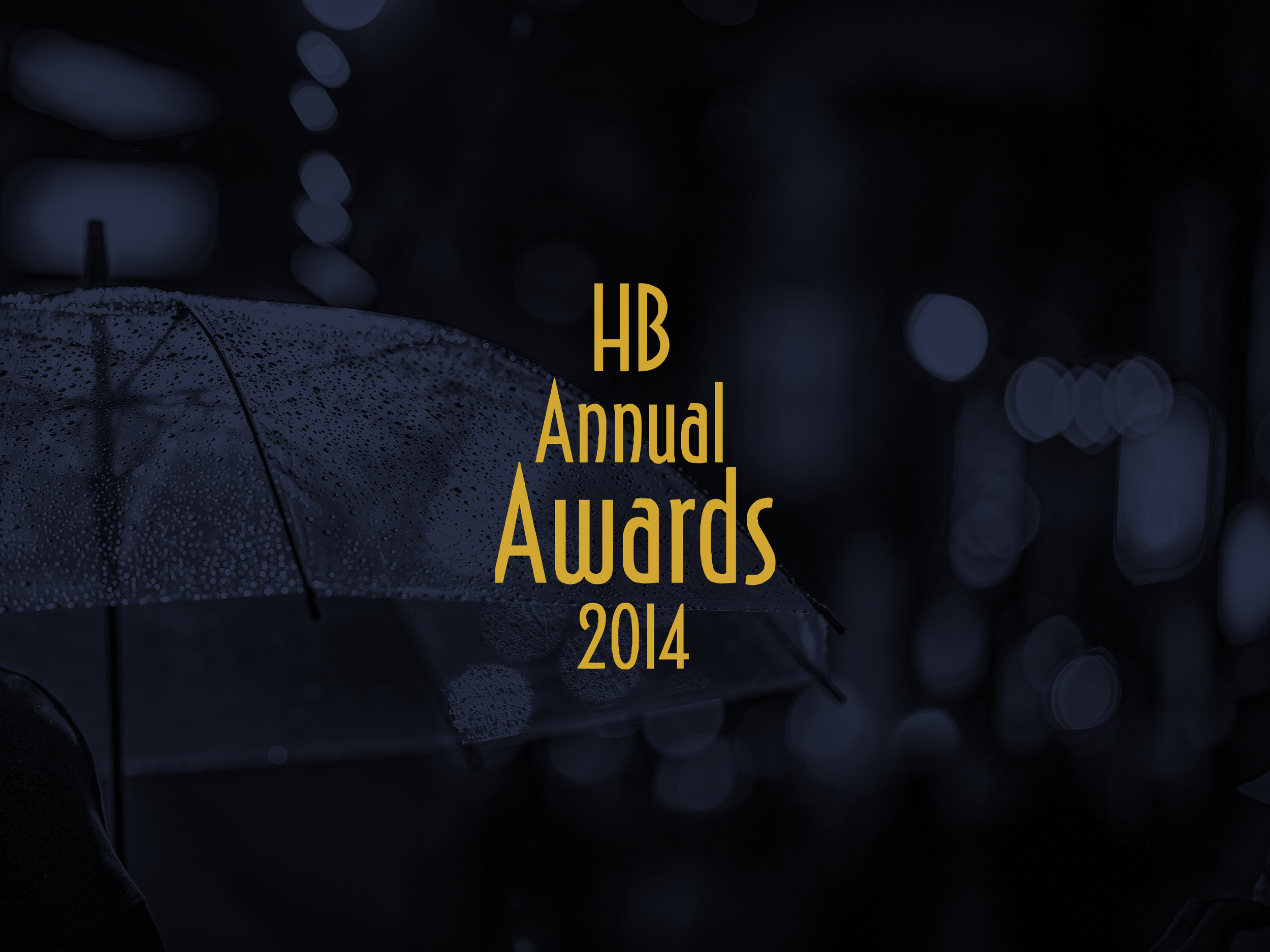 The image shows a dark background with blue and purple bokeh lights, and text that reads 'HB Annual Awards 2014' in gold lettering, partially visible near the bottom.