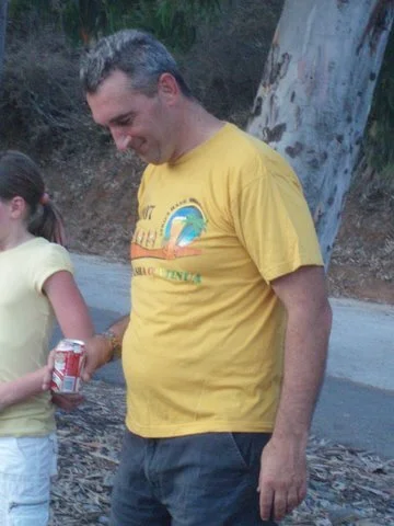 Tightarse admires his gut.jpg