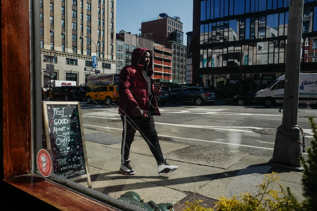 Window view from inside an NYC coffee shop.