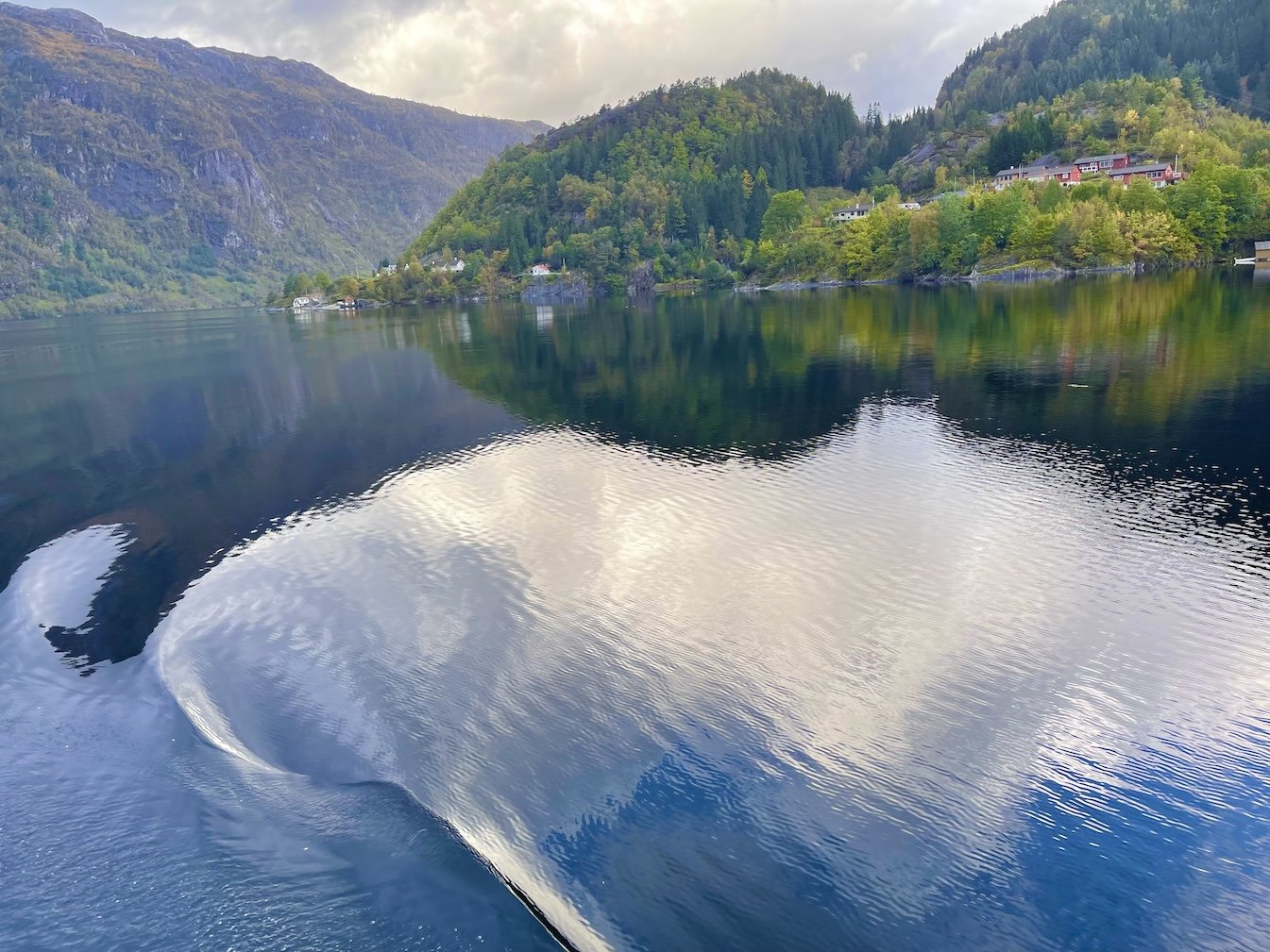clouds reflected on a body of water.jpeg