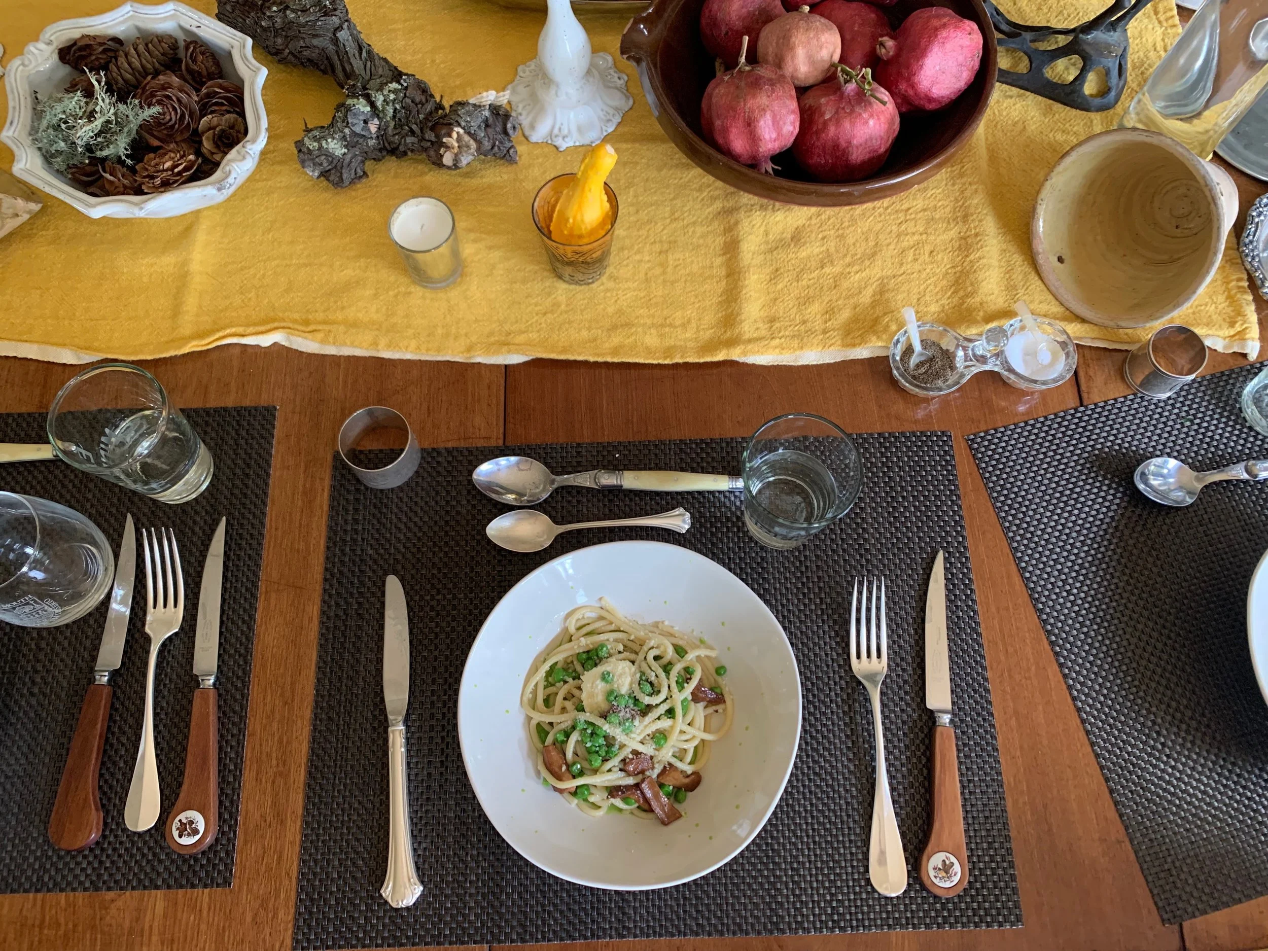 Spring tablescape with fresh pici pasta, English pea sauce, foraged chanterelles, ricotta and a little pecorino.