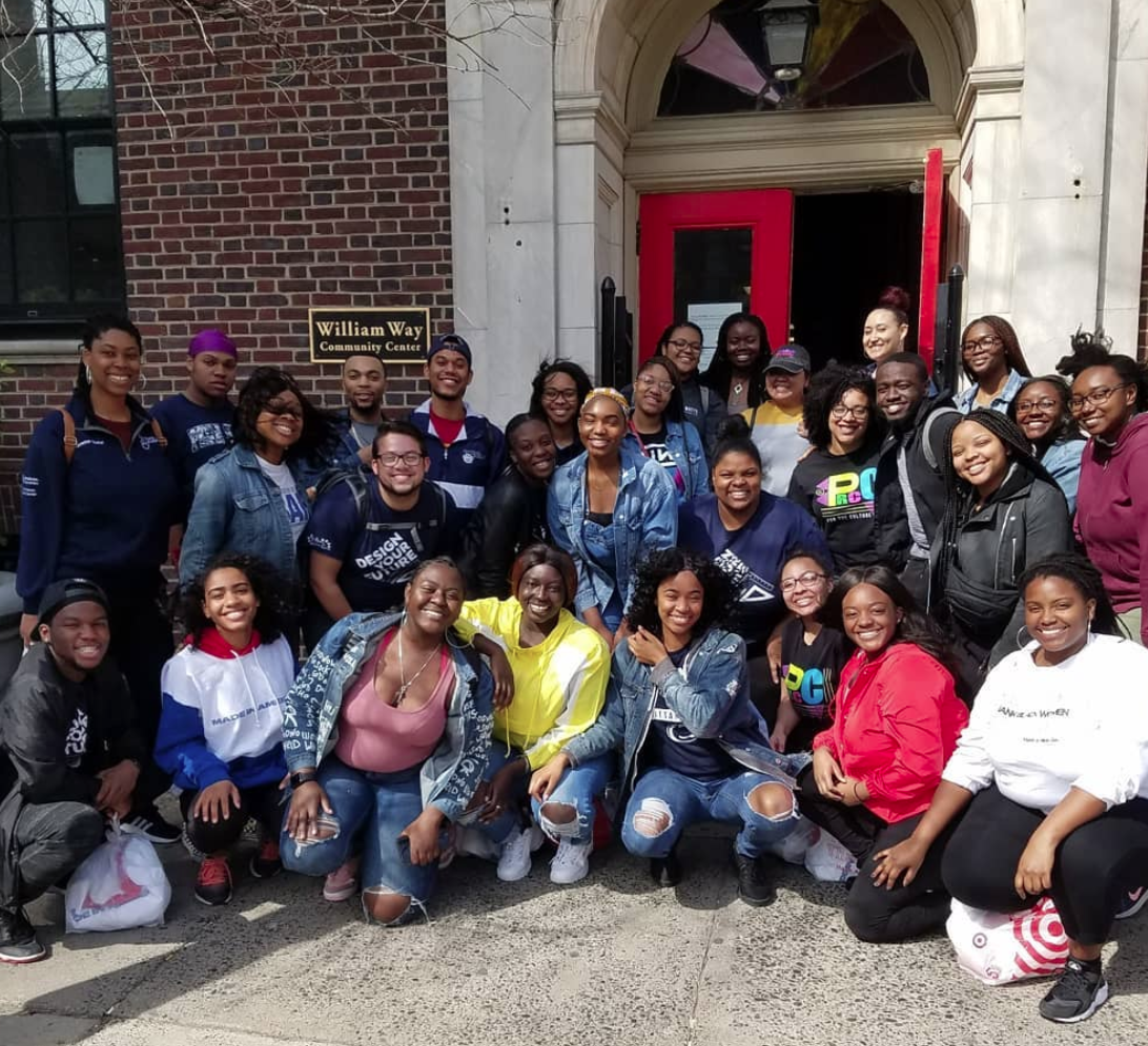 More than a dozen volunteers posing for a picture outside of the William Way Community Center.