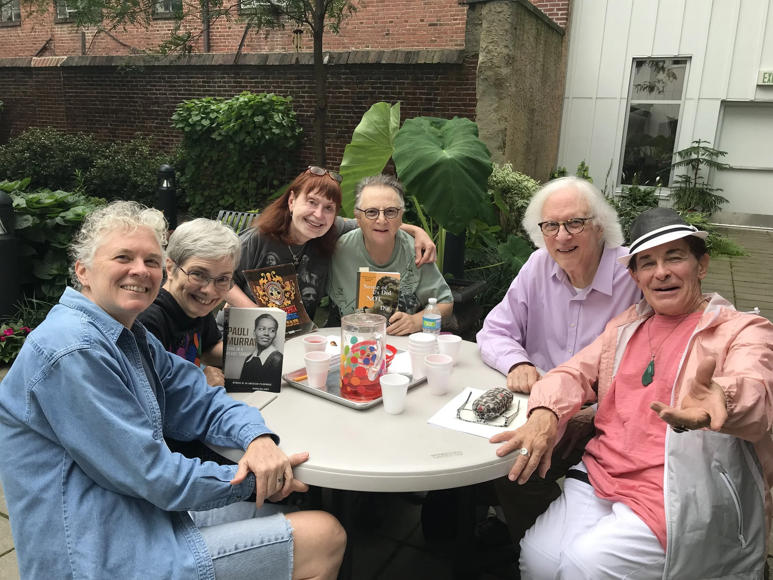 Older adults gathered together for a book club discussion