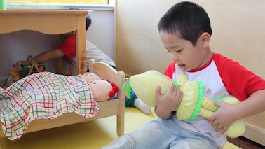 Boy-with-doll-378x213.jpg