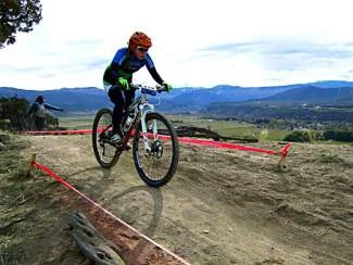 A competitor navigates the Haymaker Trail during the Colorado High School Cycling Legue Championship held this fall in Eagle. The developers of the Haymeadow project agreed to allow an easement accorss the property so the trail could be built, and have indicated an extensive trail network is part of their overall plan for the development
