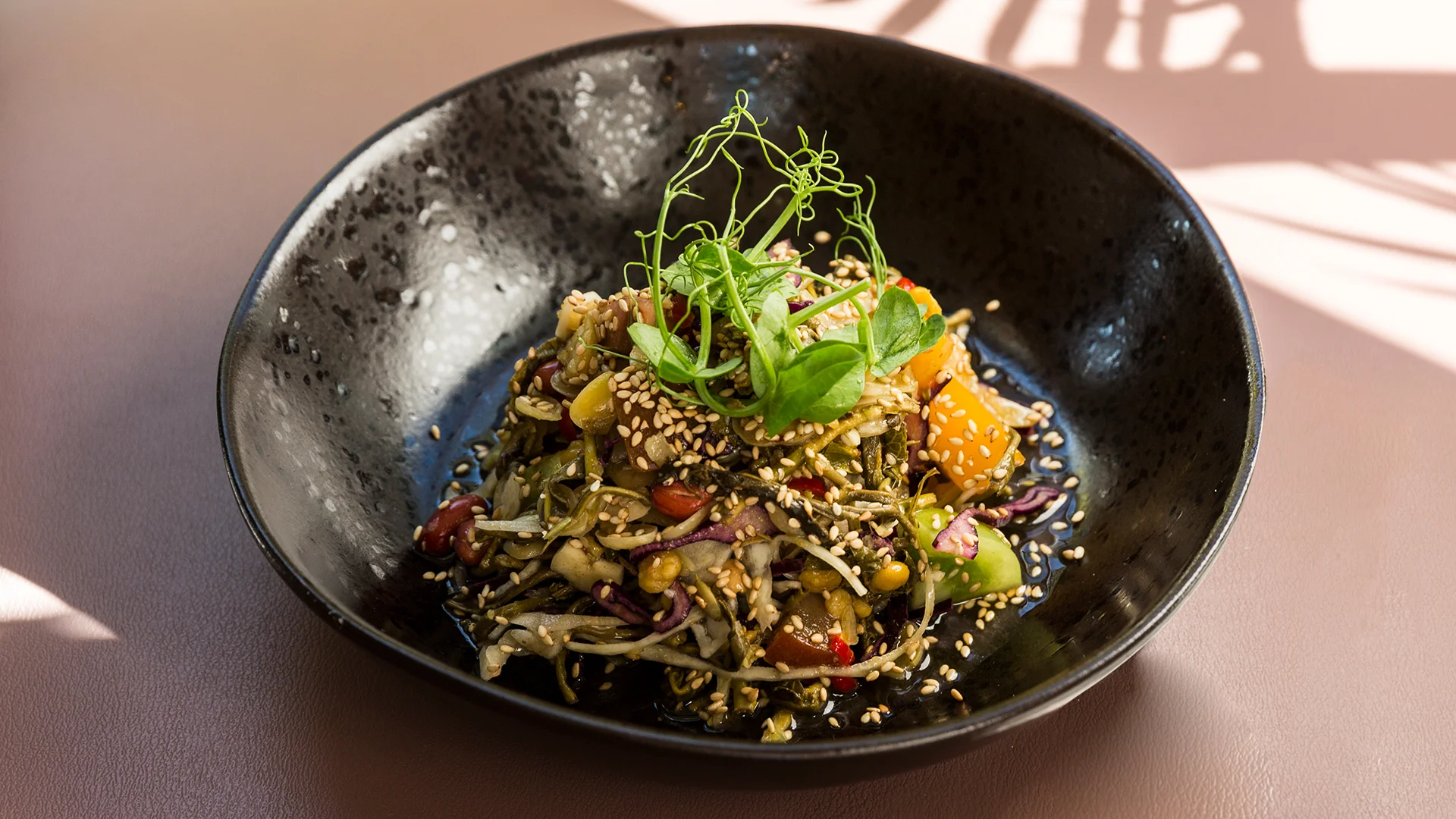 LAHPET Lahpet is Burmese for pickled tea...which seems a strange name choice for a French restaurant. Just kidding, Lahpet serves up bloody marvellous modern Burmese cuisine at their new venue in Shoreditch, having moved from their original site in Hackney. Time Out describes the new place as “achingly stylish” which is what we’ve all grown to expect from anything that crops up in Shoreditch to be honest. Wooden flooring, large windows, tiling and a scattering of plants make the fresh space feel welcoming despite its size. But less about the decor and more about the food right? A blend of Indian and Thai flavours make up the Burmese palate and with everything from small plates, to salads, to bowls, there is a dish for everyone. Our pick of the bunch would be the Hake Masala with lemongrass rosti, the stuffed aubergine with dried shrimp and oyster mushroom or the Ginger salad. If you don’t fancy the full dine in experience, then you could pop along to Old Spitalfields Market where they have the Lahpet Street Food Kitchen instead. Lahpet won't break the bank either which is always a bonus but it will make your taste buds explode. Facebook | Instagram | Twitter