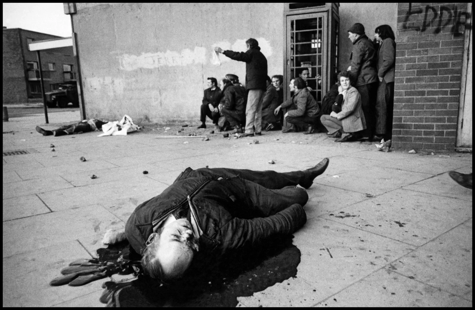 NORTHERN IRELAND. Derry / Londonderry. 30th January 1972 . A victim, Barney McGuigan, lies in a pool of blood as the shooting stops on Bloody Sunday. Contact email: New York : photography@magnumphotos.com Paris : magnum@magnumphotos.fr London : magnum@magnumphotos.co.uk Tokyo : tokyo@magnumphotos.co.jp Contact phones: New York : +1 212 929 6000 Paris: + 33 1 53 42 50 00 London: + 44 20 7490 1771 Tokyo: + 81 3 3219 0771 Image URL: http://www.magnumphotos.com/Archive/C.aspx?VP3=ViewBox_VPage&IID=2S5RYD1VKS2&CT=Image&IT=ZoomImage01_VForm
