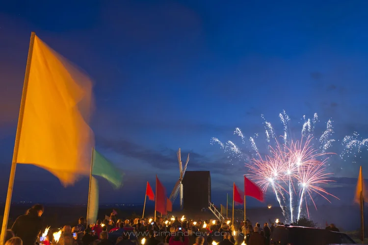 Flags and fireworks with Brill Windmill in the background.