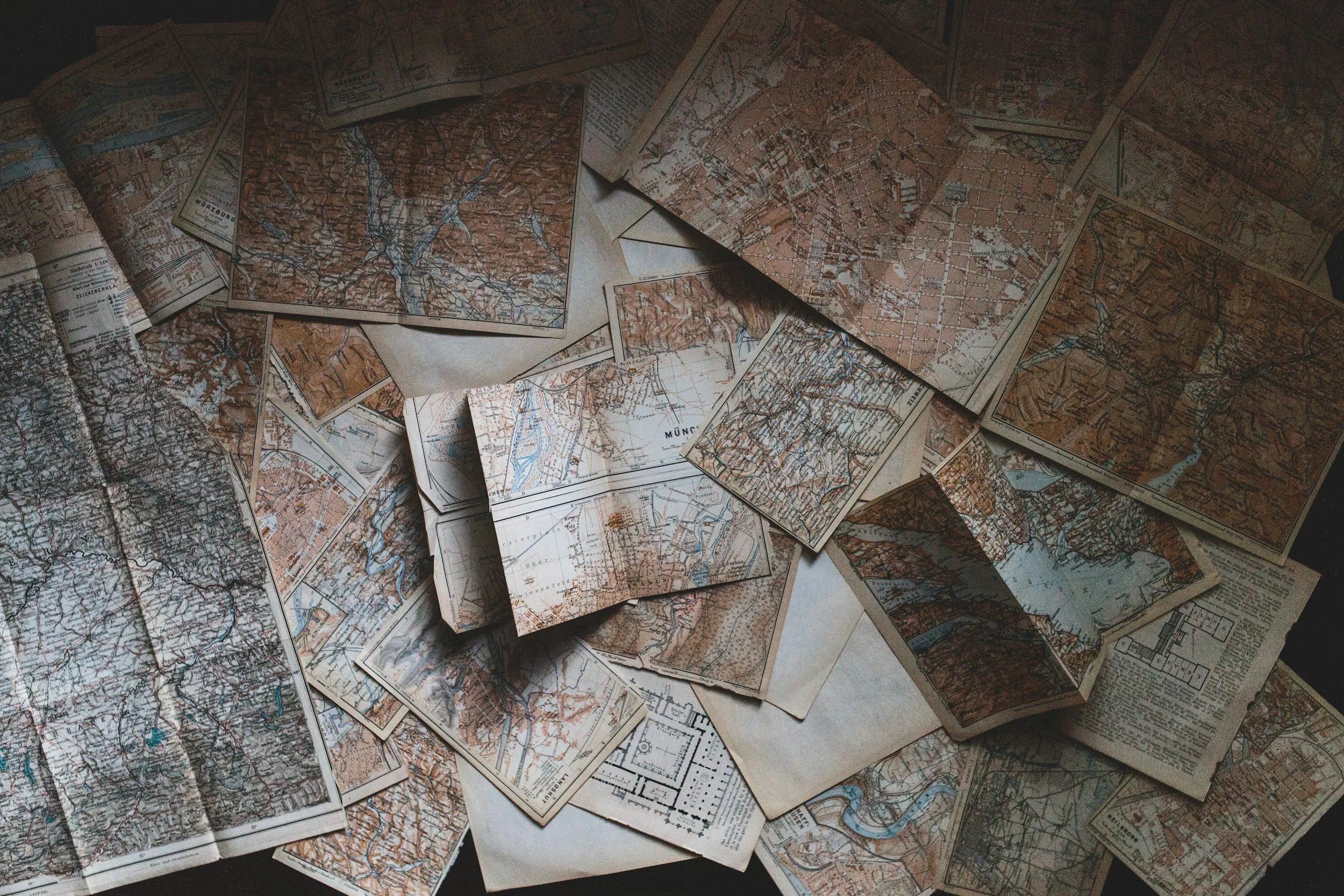 Photo of a pile of vintage road maps.
