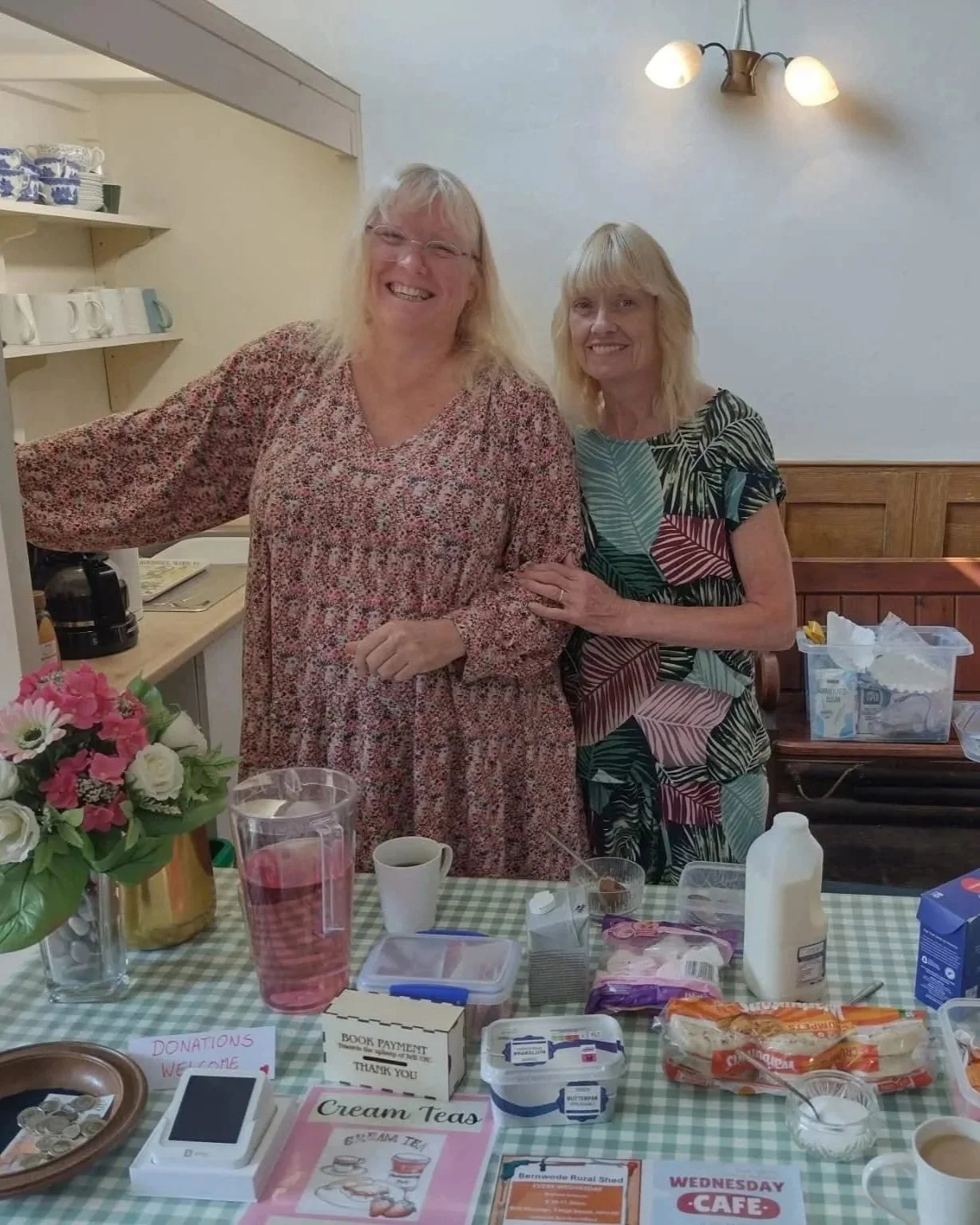 Photo of two women serving teas