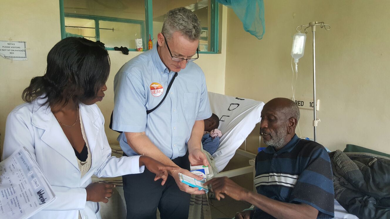  Will, with the assistance of a ward Doctors translating and discussing the importance of taking regular pain killers that we send the patients home with after an operation. 