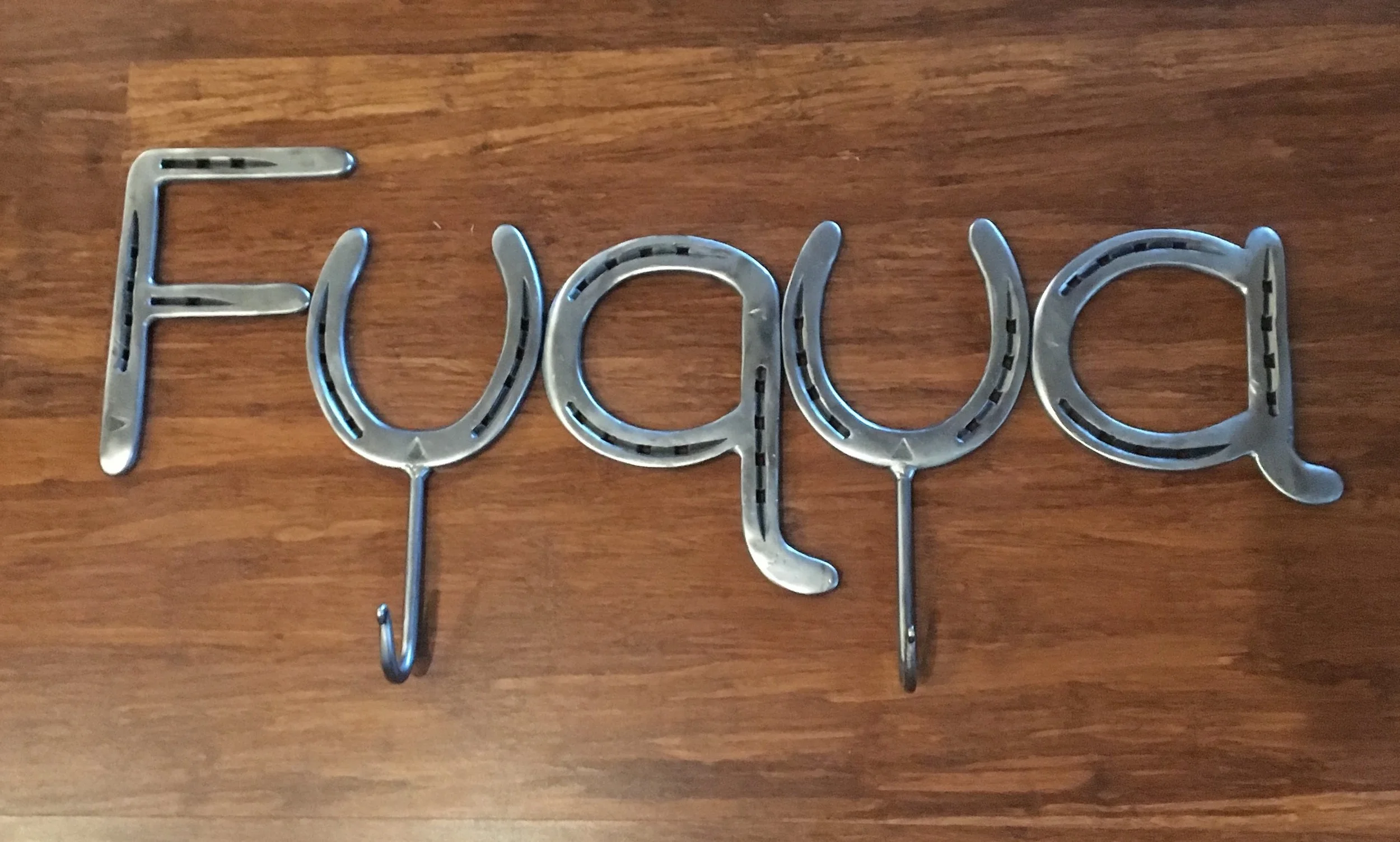 Sign with Hooks with a clients last name