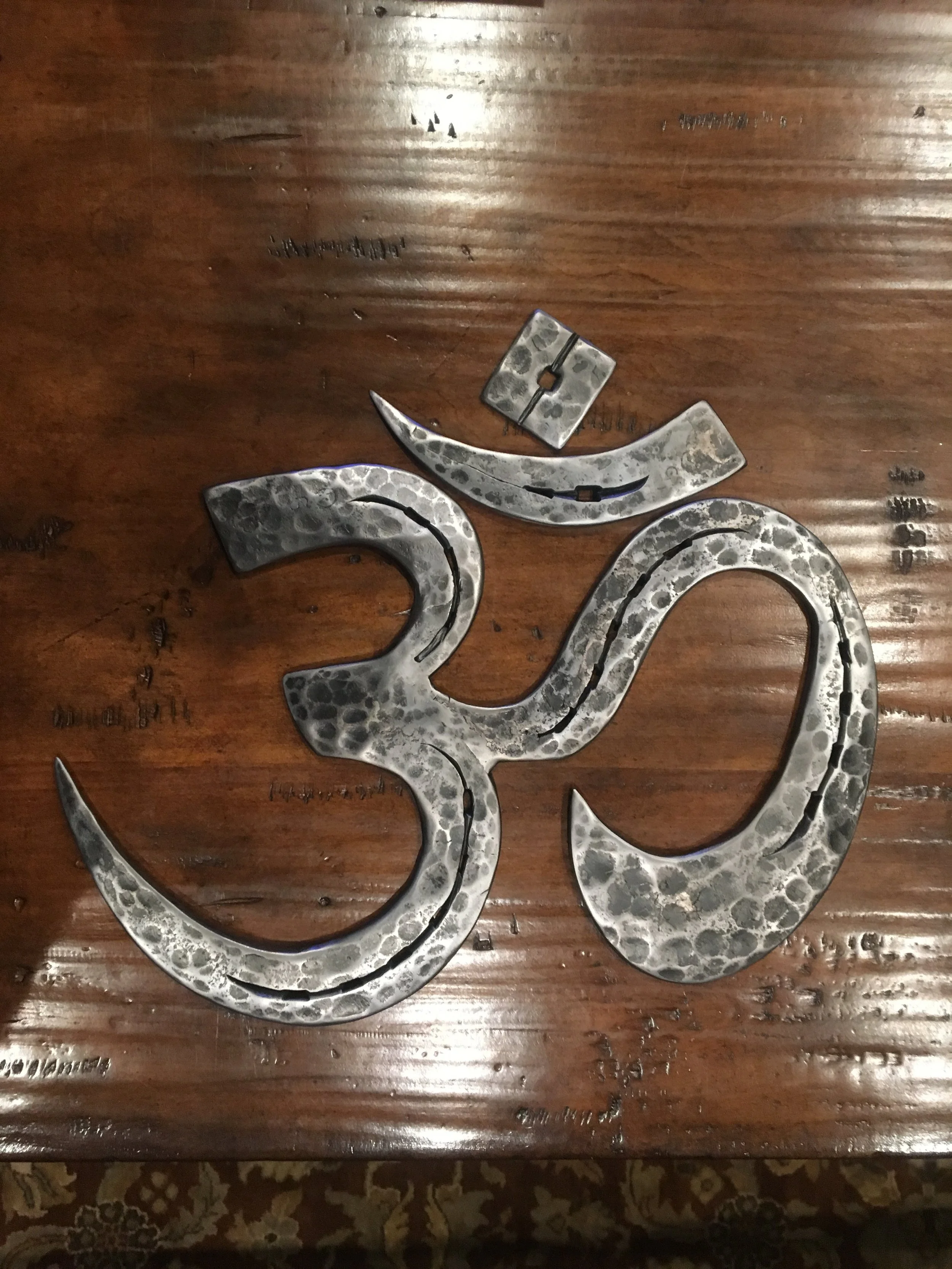 "Ohm" symbol made from horse shoes