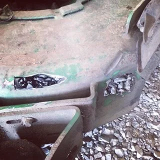 Zero Turn Lawn Mower worn through by the sand