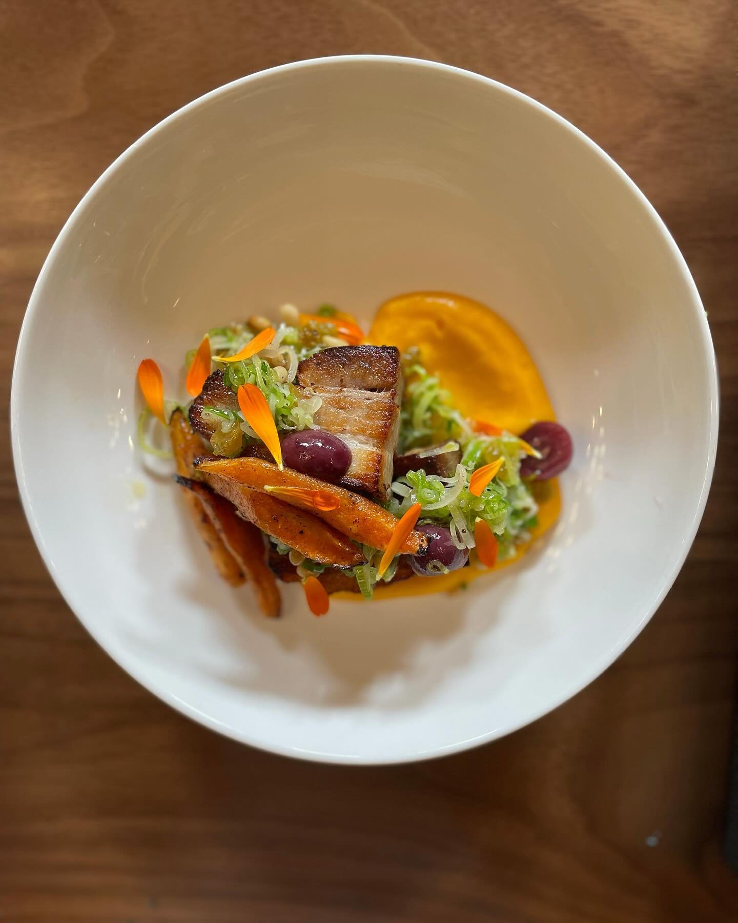 Spring is upon us and we&rsquo;re looking for ways to prepare loads of green garlic! Check out this recipe for Green Garlic Relish that our chef pairs with braised pork belly, heirloom carrots, and pickled fruit. 

Ingredients

1 pint very thinly sli