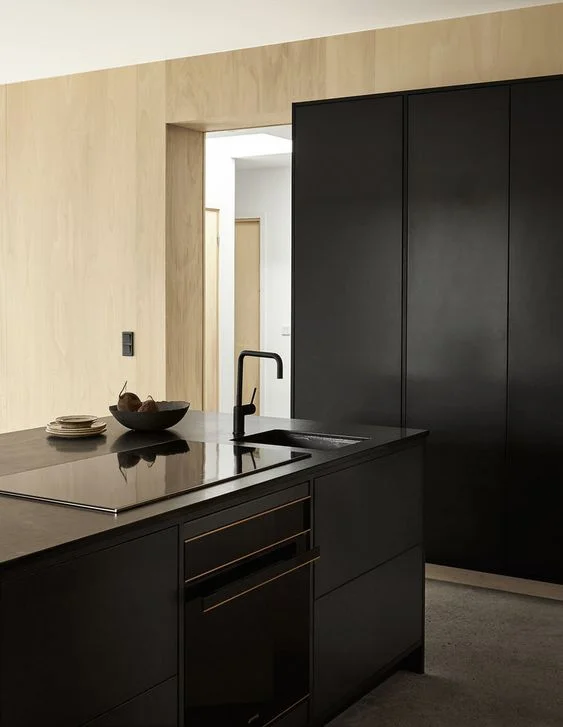 Black valchromat kitchen for artist Emma Bernhard in Torekov, Sweden. www.byrastrom.com
