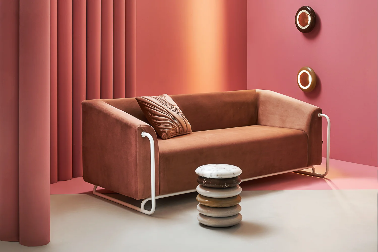 Bamboo Sofa Bent Metal & Velvet Upholstery | 29”x 79”x 33” Mudd Quilted Cushion Quilted Cotton Velvet | 18” x 18” Pebble Wall Sconce Hand Carved Marble & Hammered Copper | Diameter 12”x 5” Pebble side table Hand Carved Marble | Diameter 13”x 30”