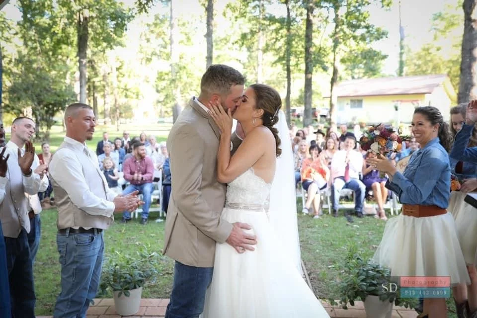 A bride and groom on the ceremony runway
