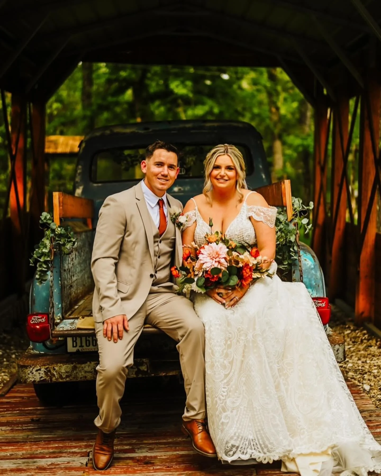 A bride and groom with our vintage Ford truck