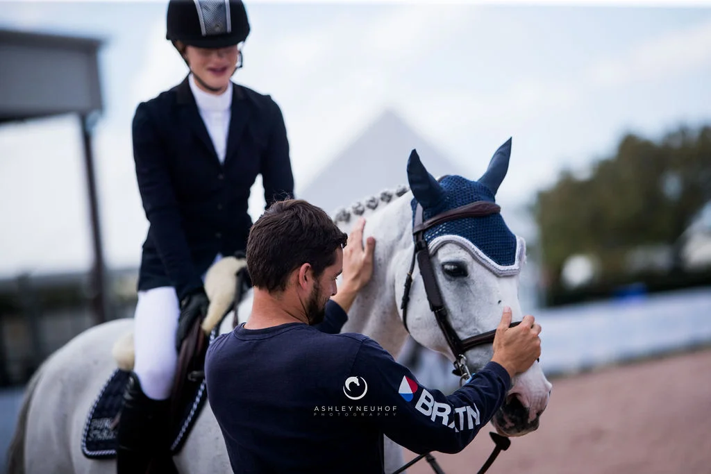 Jenn Gates and Pumped Up Kicks with the Evergate Stables Team at Winter Equestrian Festival 2019. Photo by Ashley Neuhof Photography.