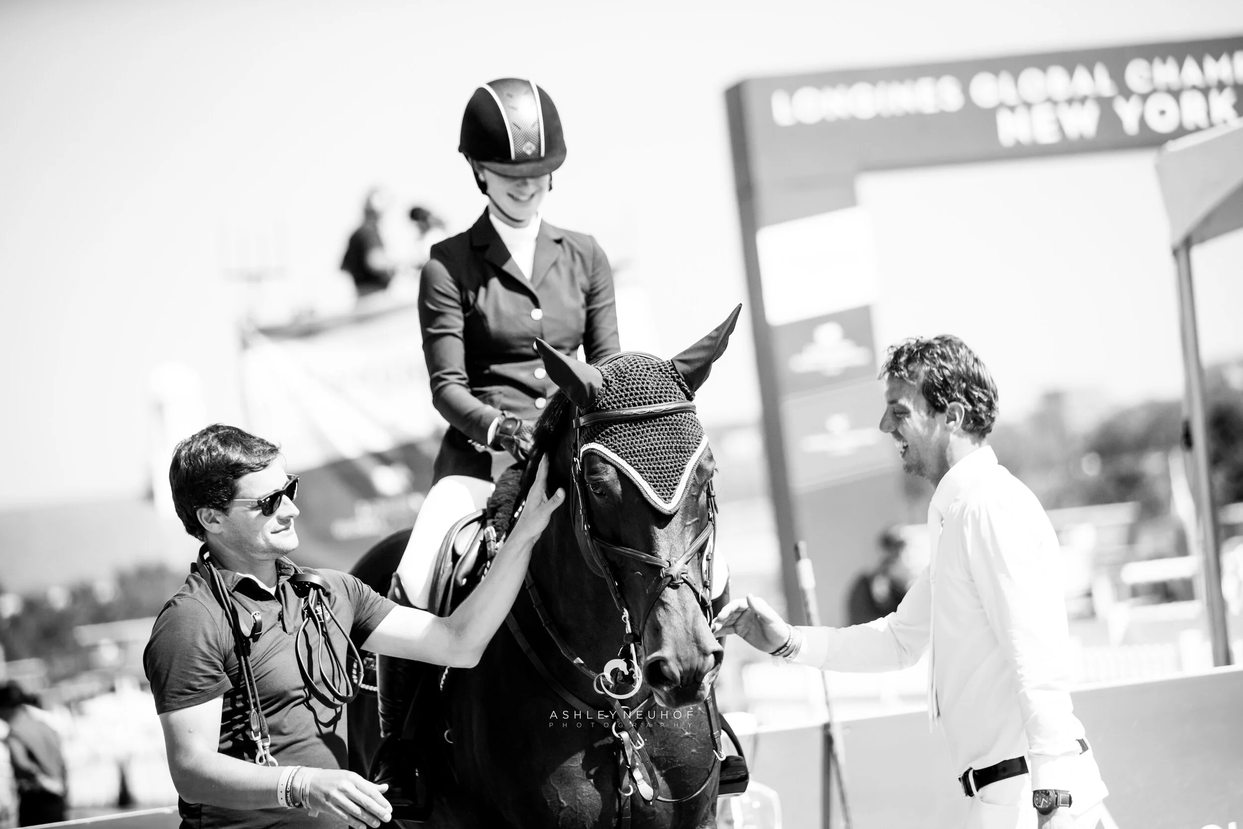 Jenn Gates and Dolinn with the Evergate Stables Team at Longines Global Champions Tour of New York 2019. Photo by Ashley Neuhof Photography.
