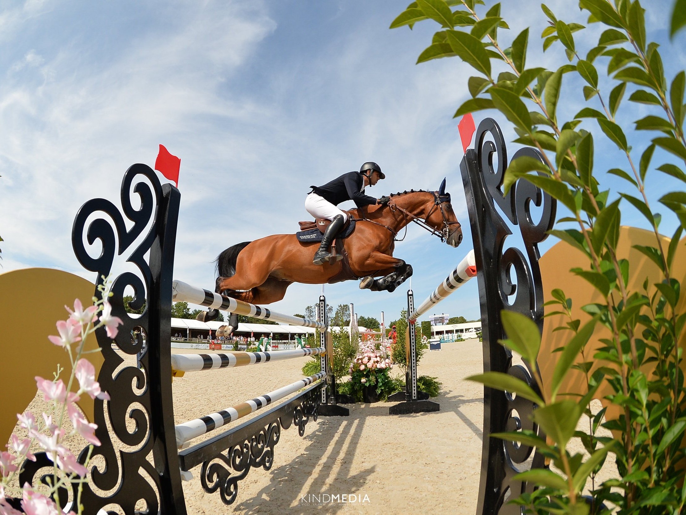  Nayel Nassar and Igor van de Wittemoere jumping at the Hampton Classic. 