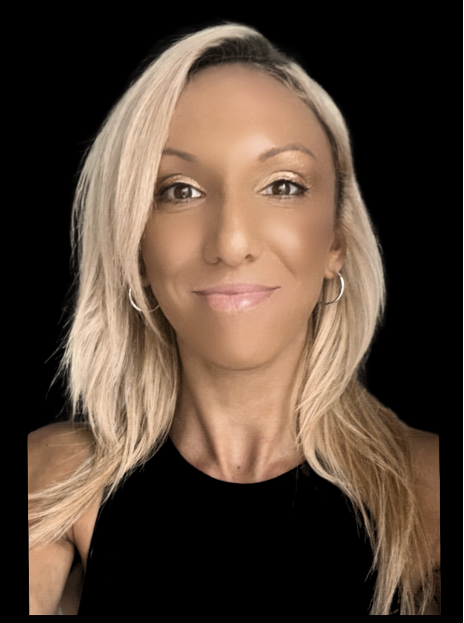 A woman with long blonde hair, wearing a black sleeveless top and hoop earrings, is smiling at the camera against a black background.