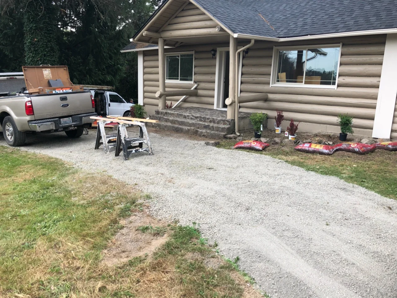 Exterior view of nearly completed log cabin home.