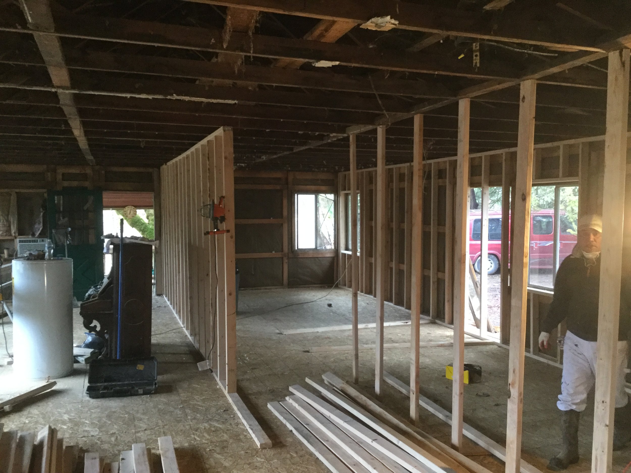 Main bedroom / living room demising wall with view of perimeter exterior wall new studs beyond.