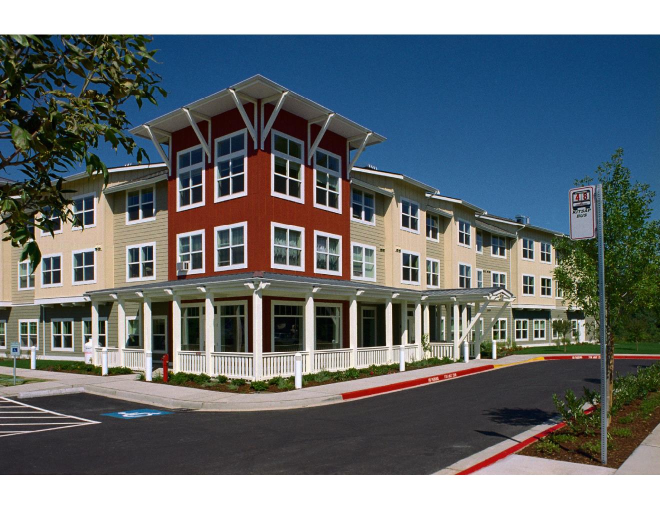 View of corner tower with living room / porch at ground floor &amp; apartment units above