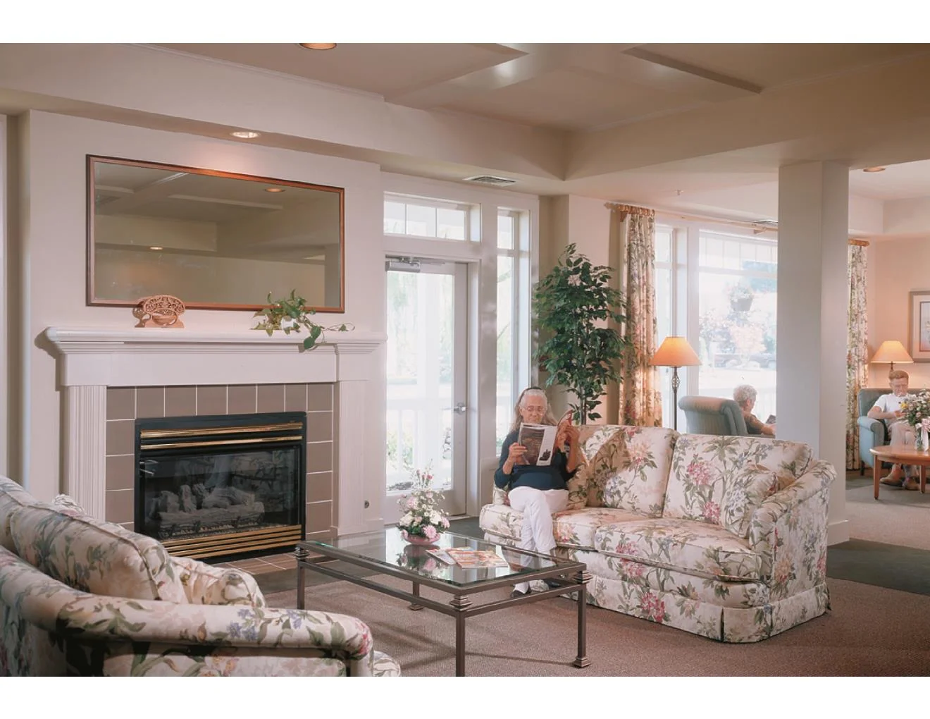 View of living room and activity room beyond.