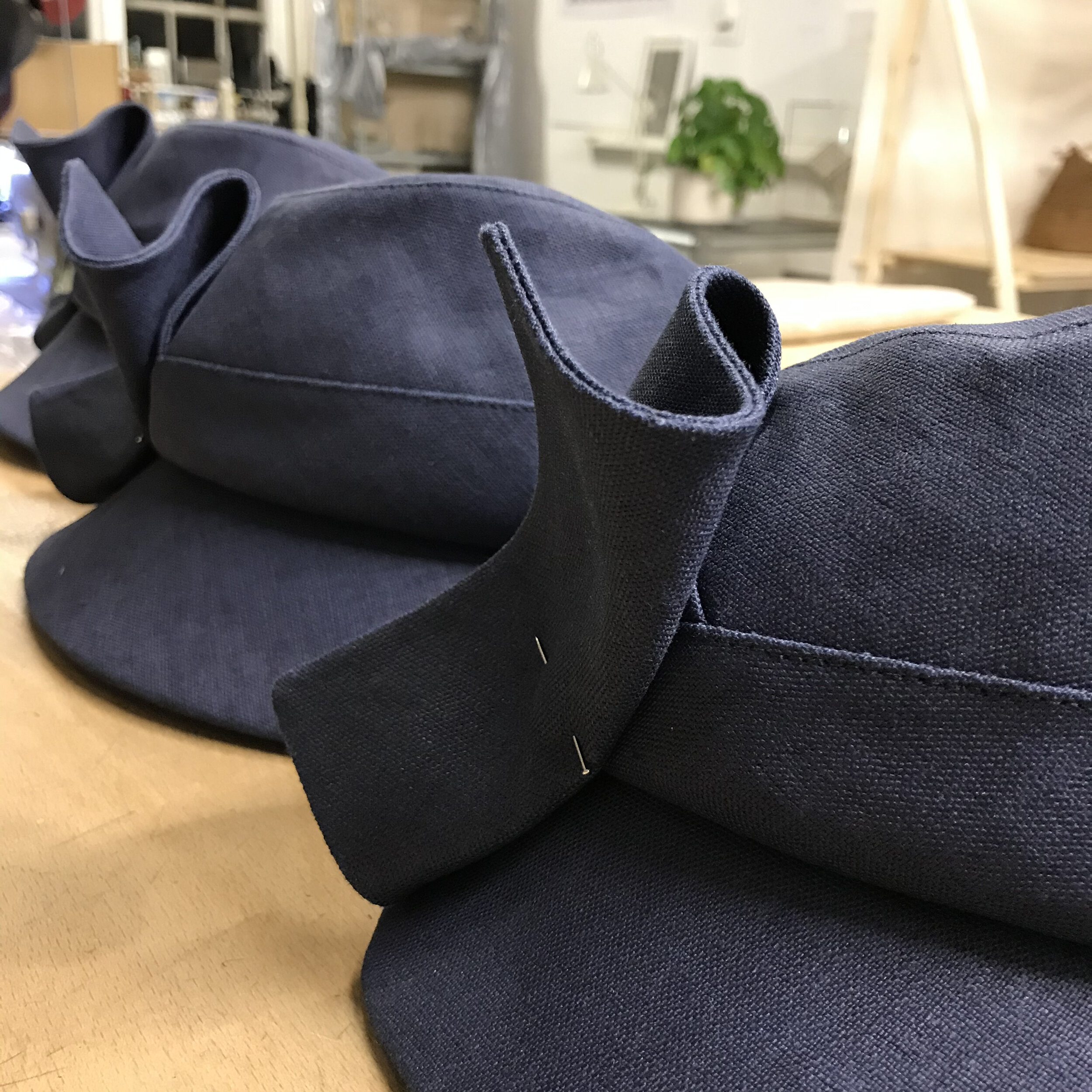  work in progress -  ‘Norah’ peaked caps  in dark blue linen 