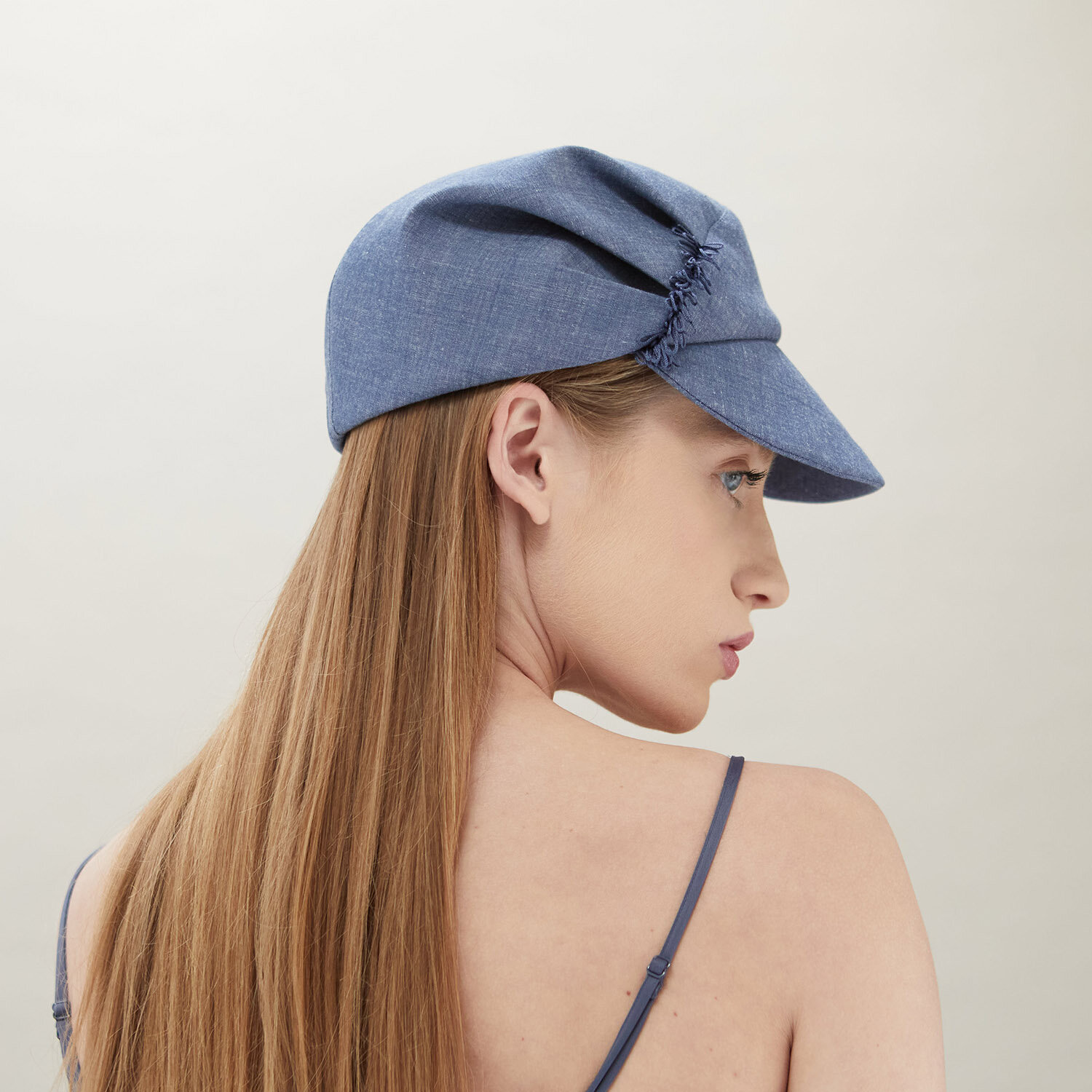   ‘Lee’ peaked cap in blue organic cotton.   Photo by James Champion 