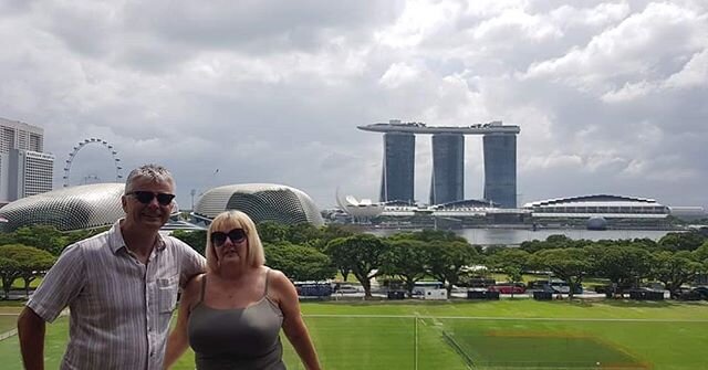 Ronald and Anne on a city tour in Singapore pre-pandemic time where they love the iconic landscape of the Marina Bay Sands Hotel.