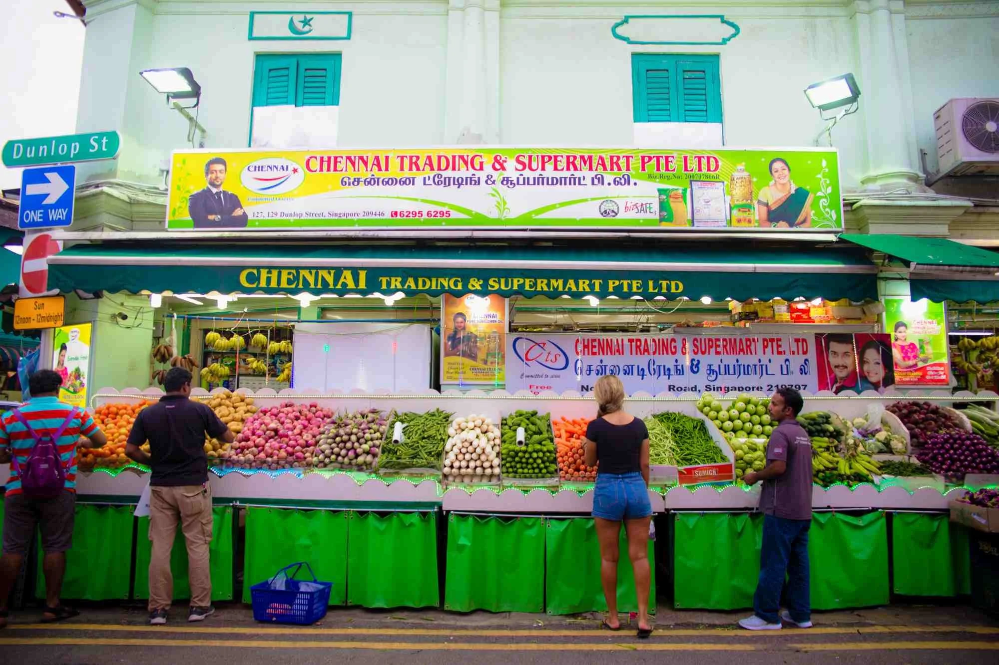 Colorful fruit and vegetable stalls at a grocer on Dunlop Street in Little India, Singapore, a stop on local food tours