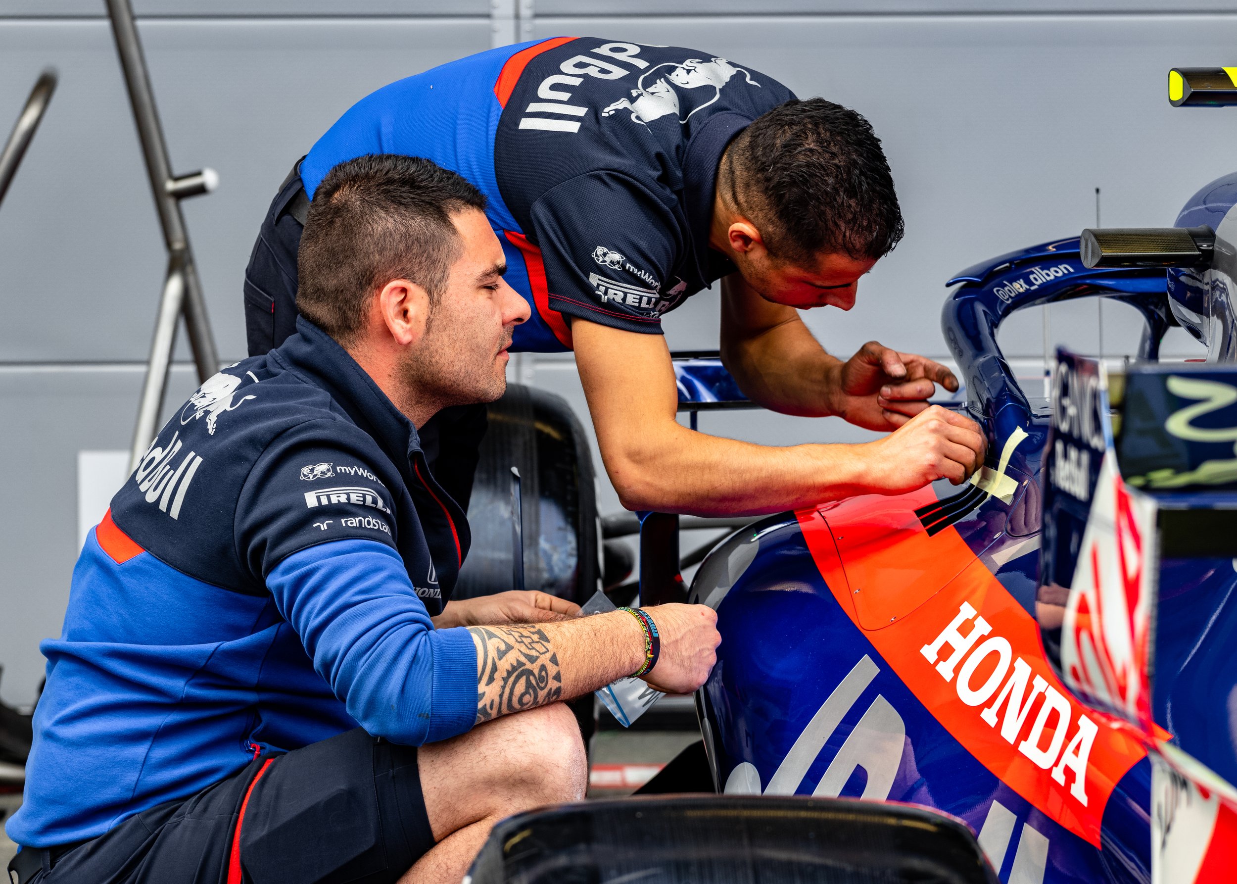 Toro Rosso engineers work on the car during the Azerbaijan race weekend in 2019