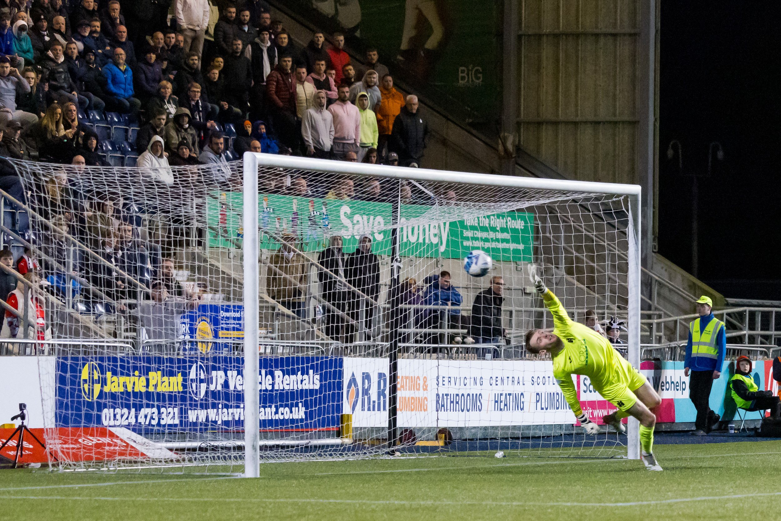  Falkirk scores Vs FC Edinburgh as their goalkeeper dives to save the ball unsuccessfully  
