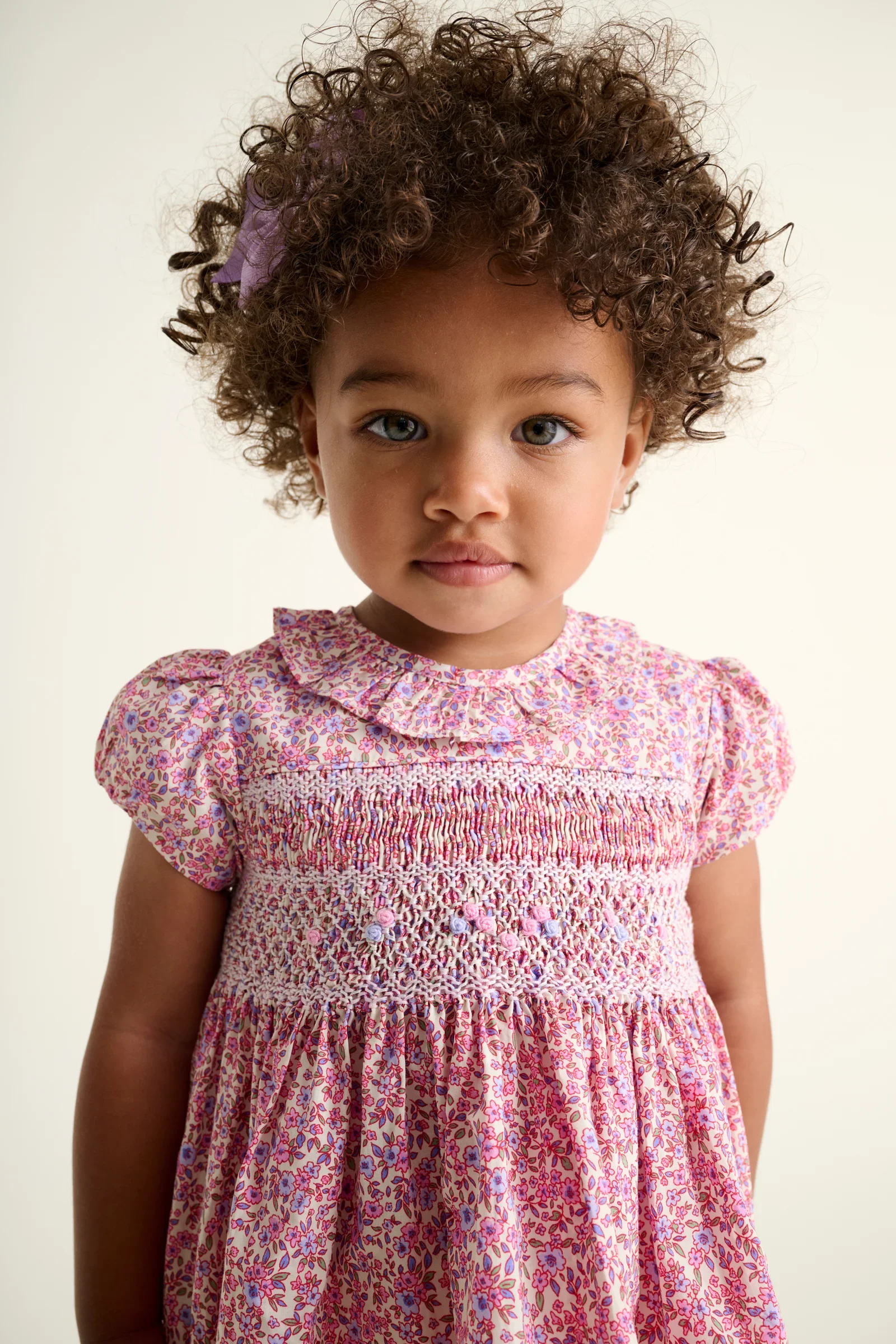 baby-dress-lavender-closeup-on-model.webp