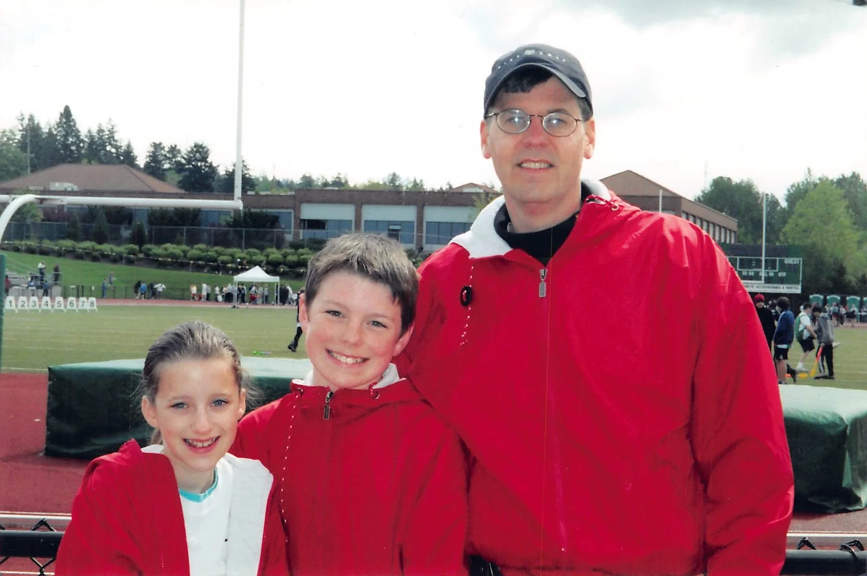 Meagan and BRian Dooney with STM CYO Track Coach john Turina