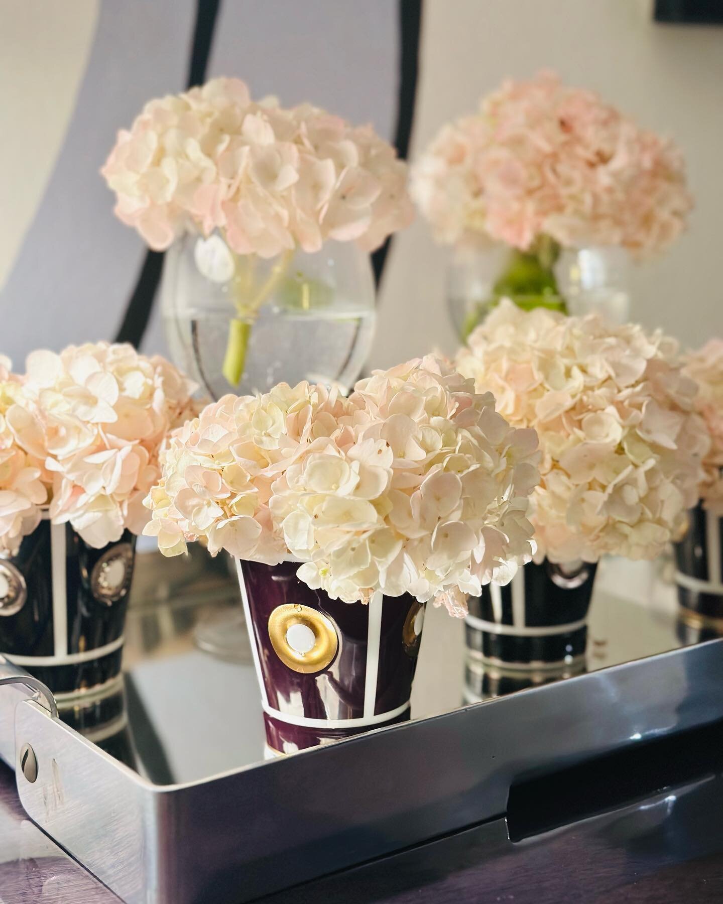 Salvaging 2 week old hydrangeas by retrimming and placing in short tumblers by Bernardaud and tall wines glasses,  served up in a vintage Italian mirrored tray.