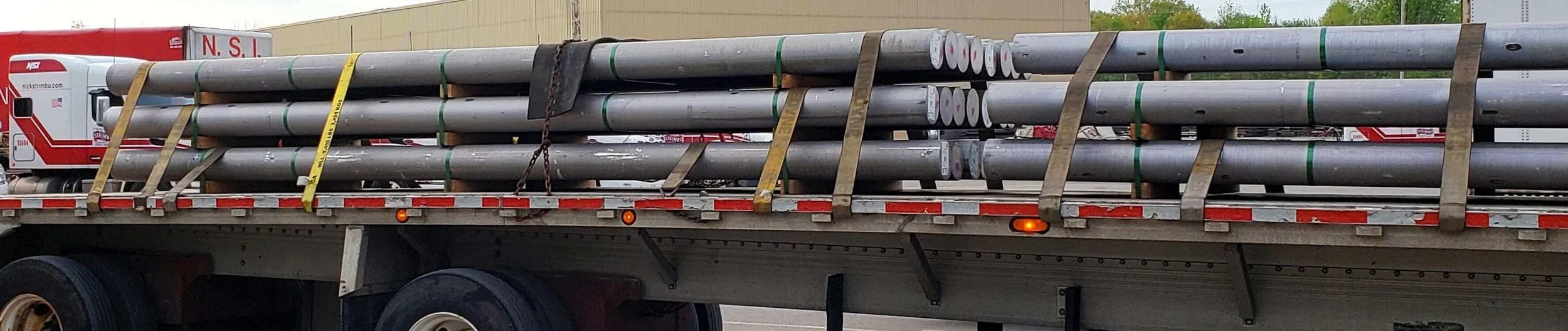 E-7: Belly strapping stabilizes multi-tier loads.