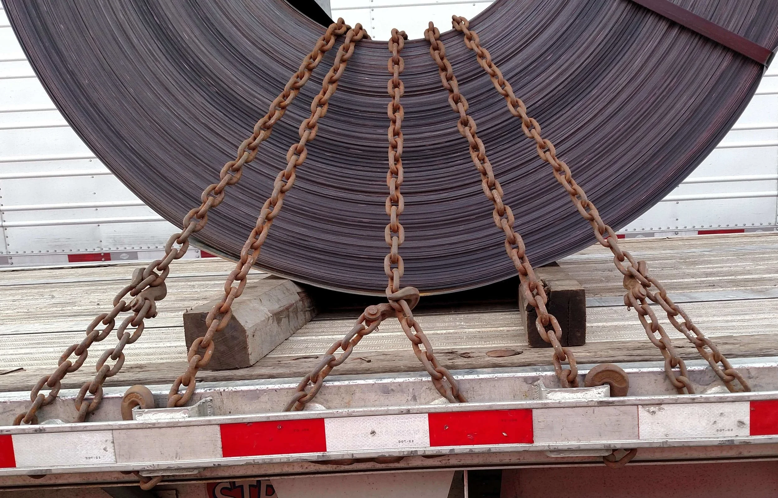 J-4: Chains should be wrapped around entire stake pocket and hooked to themselves.